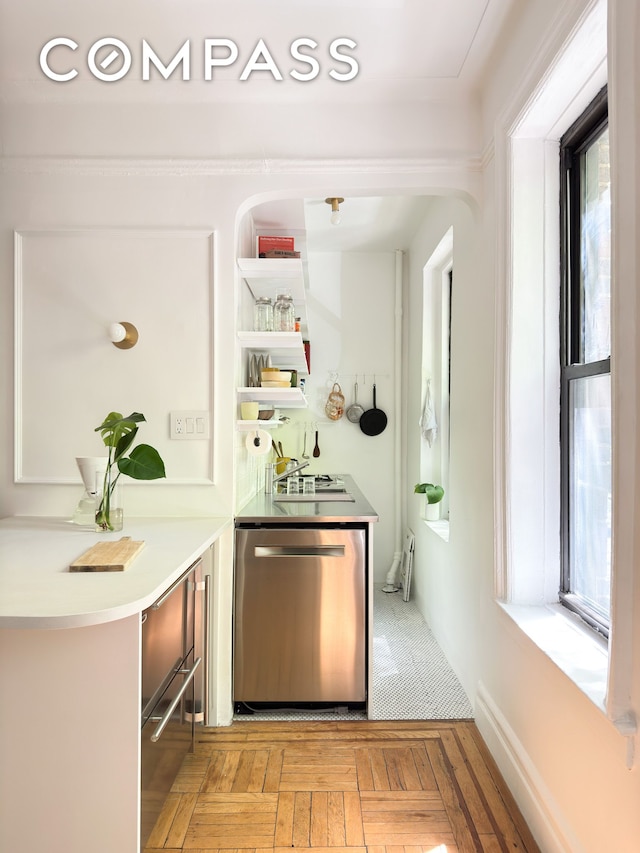 bar with a sink and dishwasher