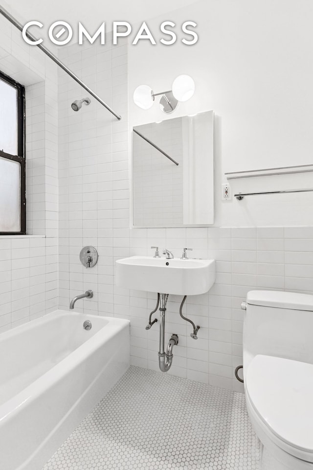 333 4th St Unit 2A, New York City, NY 11215 - full bathroom with toilet, tile walls,  shower combination, and tile patterned floors