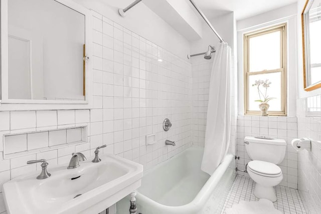 390 Riverside Dr Unit 6D, New York City, NY 10025 - bathroom featuring tile walls, a sink, toilet, tile patterned floors, and shower / tub combo with curtain