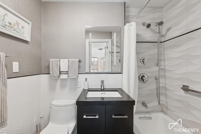 bathroom featuring shower / bath combination with curtain, toilet, tile walls, and vanity