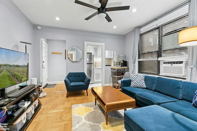 living area with recessed lighting, baseboards, ceiling fan, and cooling unit