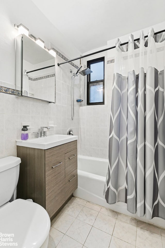 bathroom with tile walls, vanity, toilet, and shower / bath combination with curtain
