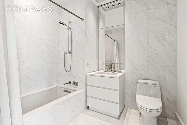 111 Murray St Unit 43B, New York City, NY 10007 - full bath featuring tile walls, tiled shower / bath combo, toilet, and vanity