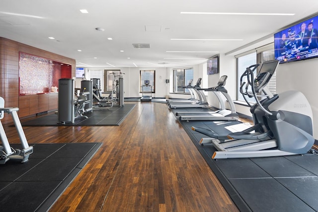 75 Wall St Unit 28-Q, New York City, NY 10005 - exercise room featuring wood finished floors and recessed lighting