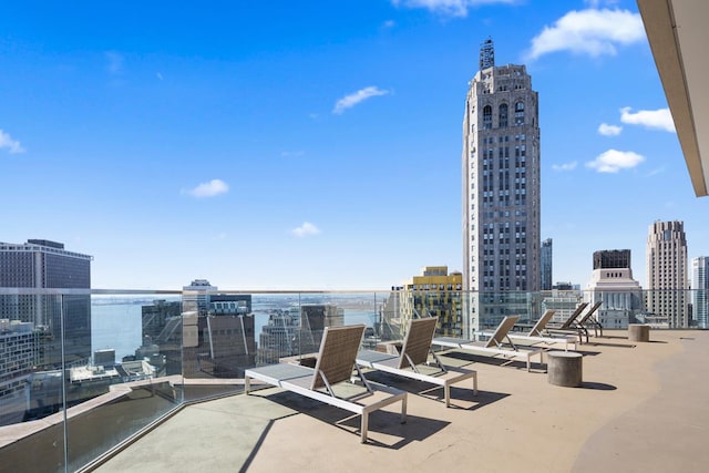75 Wall St Unit 28-Q, New York City, NY 10005 - view of patio featuring a view of city and a water view