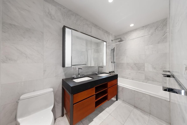 75 Wall St Unit 28-Q, New York City, NY 10005 - full bath with tile walls, toilet, double vanity, tiled shower / bath, and recessed lighting