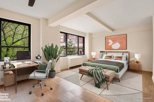 30 E 37th St Unit 4Hj, New York City, NY 10016 - bedroom featuring beam ceiling, radiator heating unit, a desk, and ceiling fan