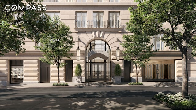 entrance to property featuring french doors and a balcony