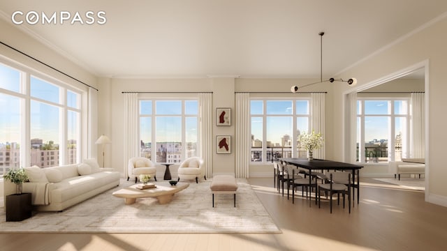 living area featuring wood finished floors, healthy amount of natural light, crown molding, and baseboards