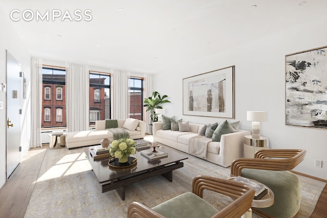 living area featuring wood finished floors and baseboards