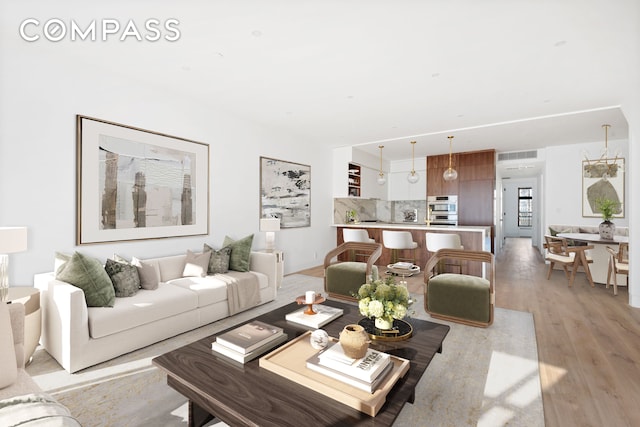 living area with light wood-style floors