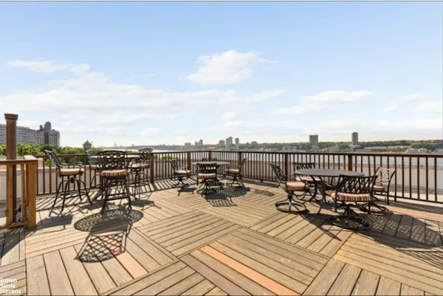 deck with outdoor dining area