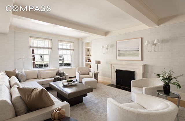 40 E 66th St Unit 9A, New York City, NY 10065 - living room with beamed ceiling, a fireplace with flush hearth, baseboards, wood finished floors, and built in shelves