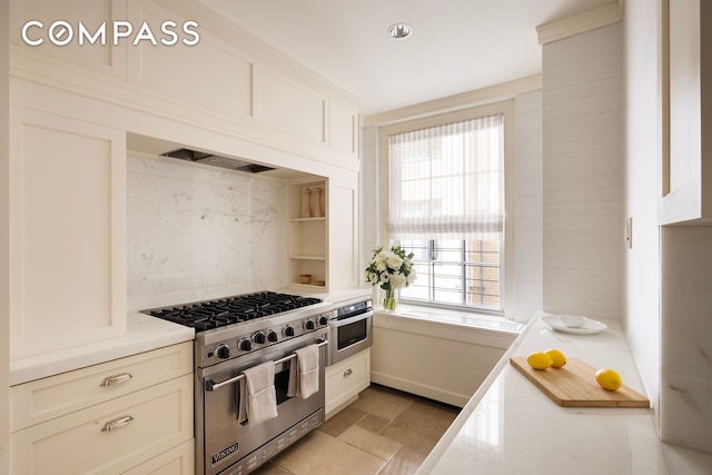 40 E 66th St Unit 9A, New York City, NY 10065 - kitchen featuring stainless steel appliances, light countertops, white cabinets, and open shelves