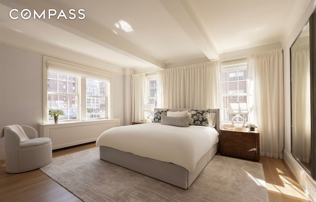 40 E 66th St Unit 9A, New York City, NY 10065 - bedroom with light wood-type flooring and beam ceiling