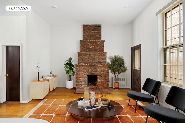 234 E 35th St Unit 5, New York City, NY 10016 - living room featuring wood-type flooring and a brick fireplace