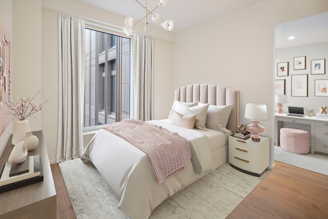 bedroom featuring wood finished floors, a chandelier, and recessed lighting