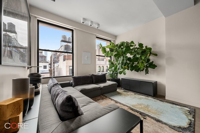 30 E 10th St Unit 10N, New York City, NY 10003 - living room featuring baseboards