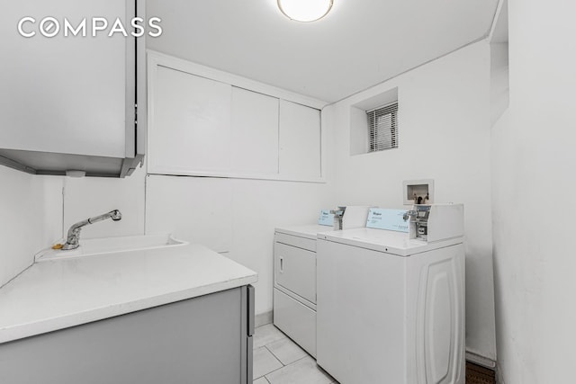 shared laundry area with washer and dryer, light tile patterned floors, visible vents, and a sink