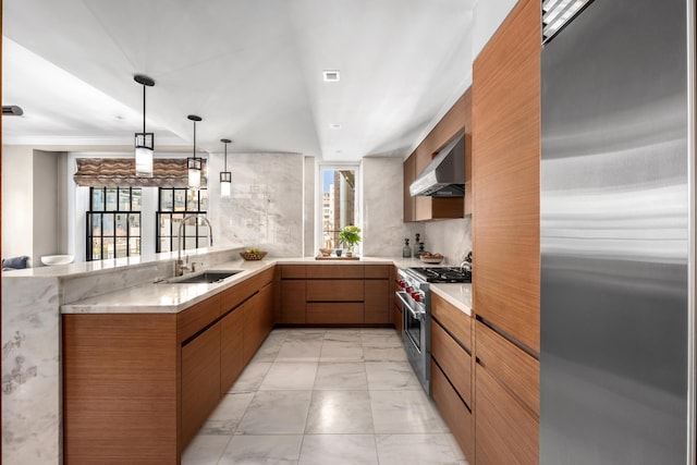 kitchen with a sink, marble finish floor, high quality appliances, a peninsula, and ventilation hood