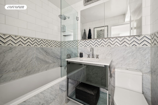 full bath with toilet, shower / bath combination with glass door, and vanity