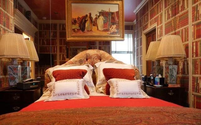 bedroom featuring crown molding