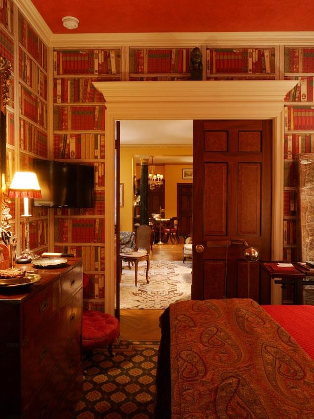 bedroom with a notable chandelier and crown molding