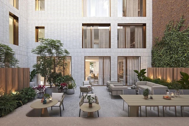 back of house with outdoor lounge area, a patio, and fence