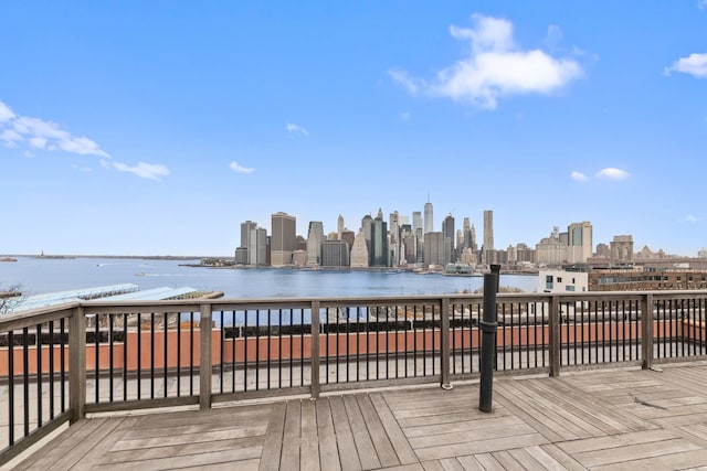 deck featuring a city view and a water view