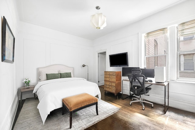 bedroom with wood finished floors