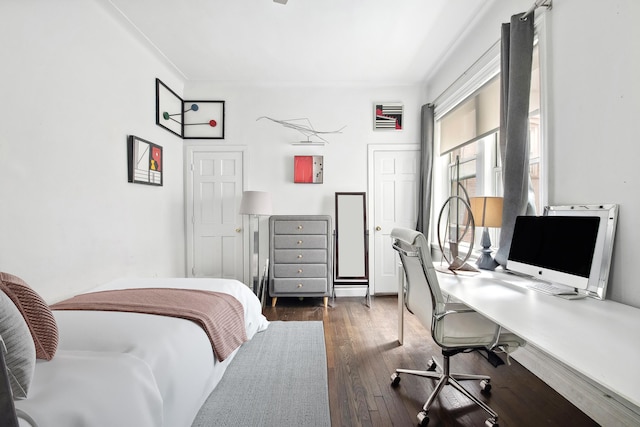 bedroom featuring dark wood finished floors