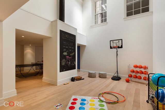 87 Leonard St Unit Mais1B, New York City, NY 10013 - exercise area featuring baseboards, wood finished floors, and a towering ceiling