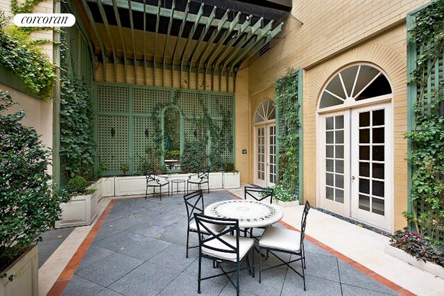400 E 51st St Unit 4E, New York City, NY 10022 - view of patio / terrace with french doors and outdoor dining area