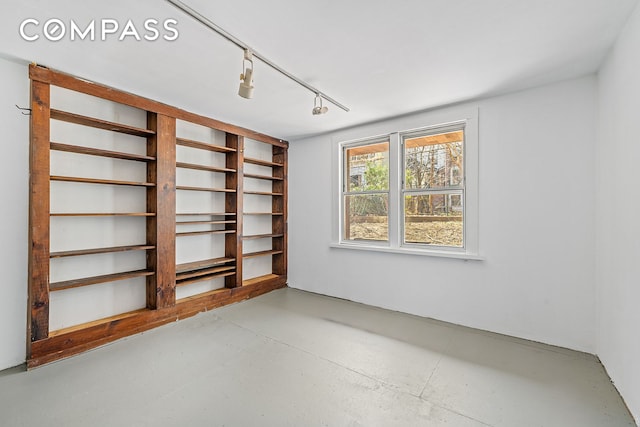 empty room with finished concrete flooring