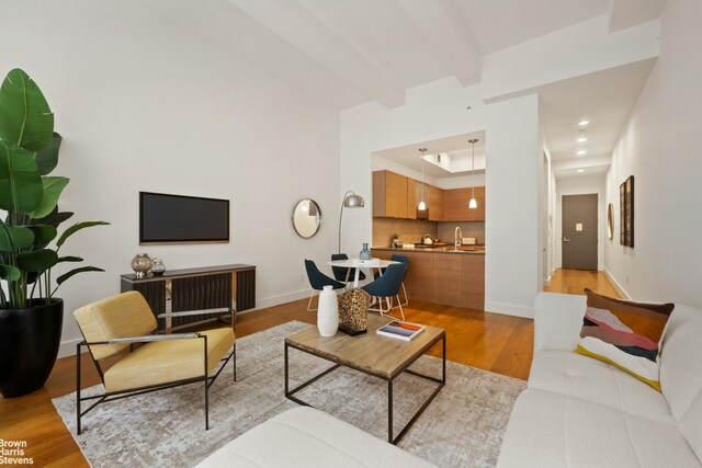 49 E 21st St Unit 2B, New York City, NY 10010 - living room with light wood-style flooring, baseboards, and recessed lighting