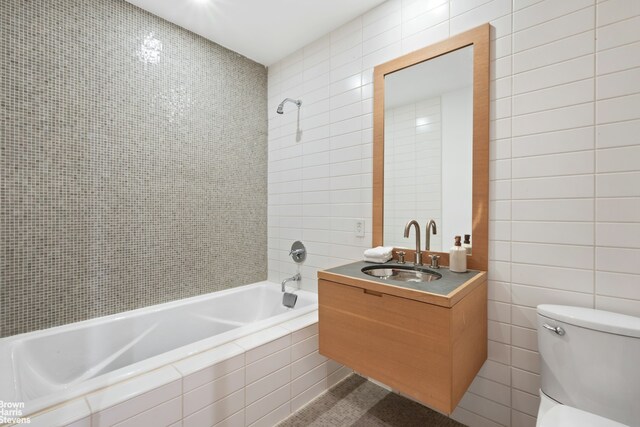 49 E 21st St Unit 2B, New York City, NY 10010 - full bath with tile walls, vanity, and tiled shower / bath