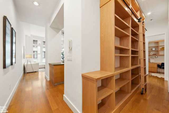 49 E 21st St Unit 2B, New York City, NY 10010 - hallway featuring light wood finished floors, baseboards, and recessed lighting