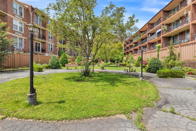 view of home's community with a lawn
