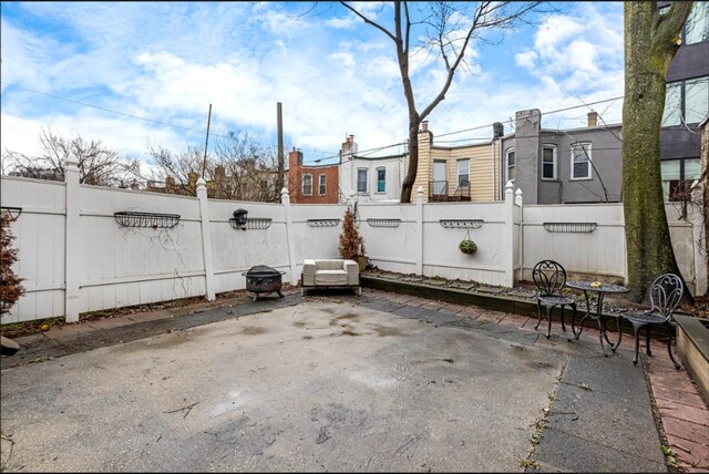 view of patio / terrace featuring fence