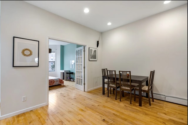 dining area with french doors, recessed lighting, light wood finished floors, and baseboards