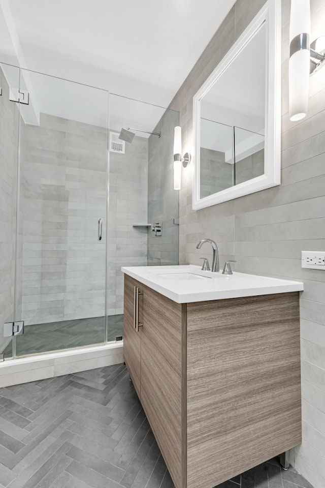 333 E 34th St Unit 2M, New York City, NY 10016 - full bathroom with tile walls, vanity, and a shower stall