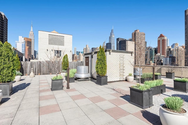 333 E 34th St Unit 2M, New York City, NY 10016 - view of patio / terrace featuring a view of skyline and fence