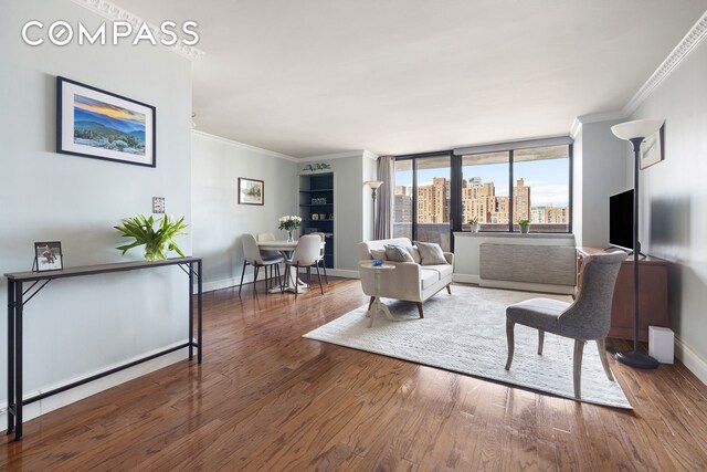 233 E 86th St Phb, Phb, New York City, NY 10028 - living room with ornamental molding, wood finished floors, and baseboards