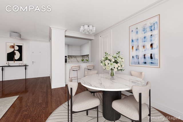 233 E 86th St Phb, Phb, New York City, NY 10028 - dining space featuring wood finished floors, baseboards, ornamental molding, and a chandelier