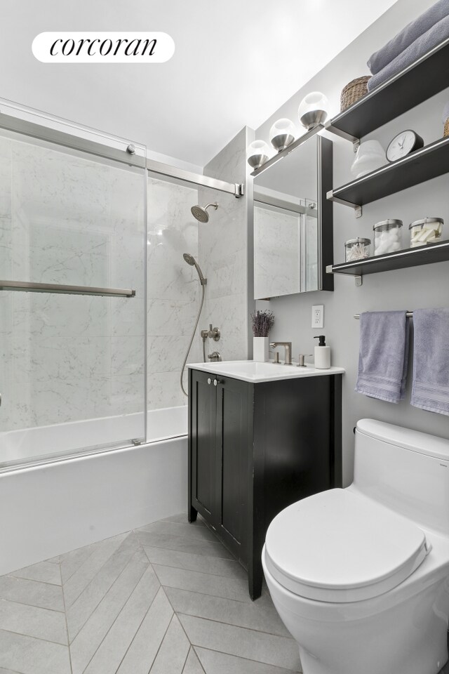 433 W 34th St Unit 6F, New York City, NY 10001 - full bath with toilet, combined bath / shower with glass door, and vanity