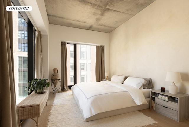 98 Front St Unit Ph3D, New York City, NY 11201 - bedroom featuring multiple windows and light wood finished floors