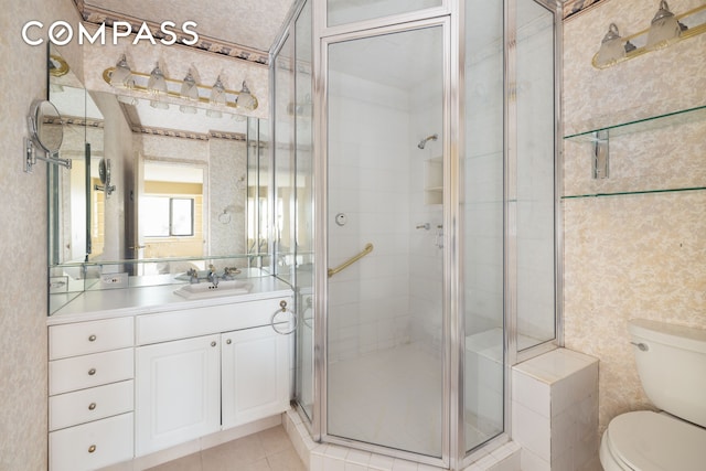 20 W 64th St Unit 41H, New York City, NY 10023 - full bath featuring vanity, a shower stall, wallpapered walls, and tile patterned floors