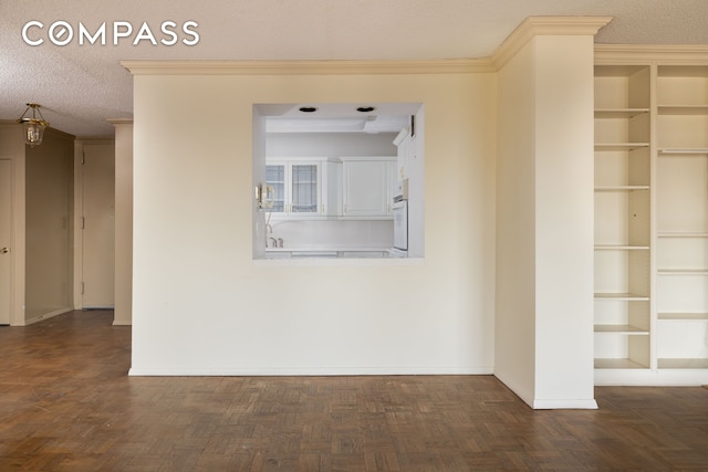 20 W 64th St Unit 41H, New York City, NY 10023 - unfurnished room with baseboards, a textured ceiling, and ornamental molding