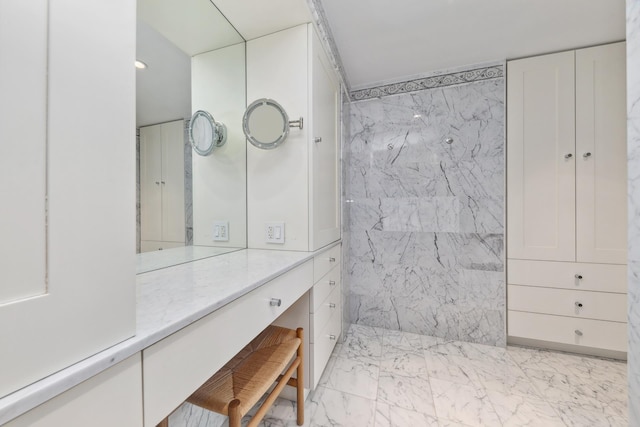 bathroom with vanity and marble finish floor
