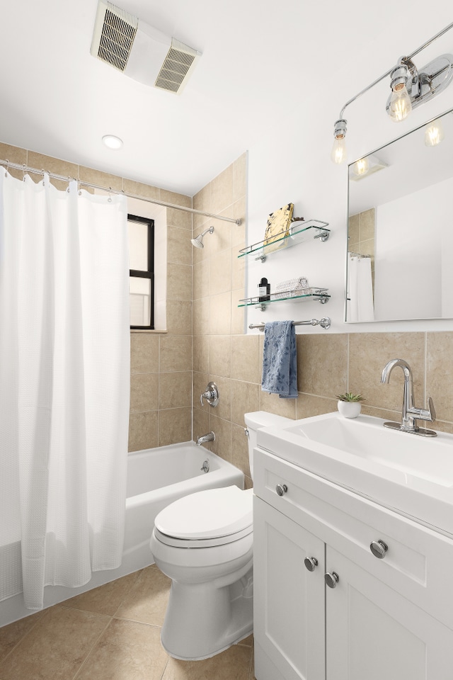 4 W 109th St Unit 2F, New York City, NY 10025 - bathroom with vanity, shower / tub combo, tile patterned floors, toilet, and tile walls